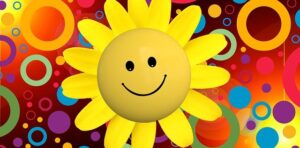 Bild von einer positiven Blume mit fröhlichem Gesicht.